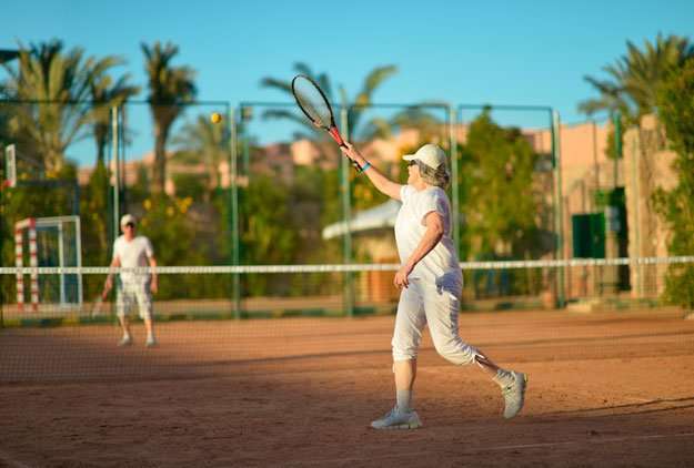 mature-couple-playing-tennis | Exercise & Reduce Stress to Lose Weight Faster | Bioidentical Hormone Therapy (BHRT) and Weight Loss