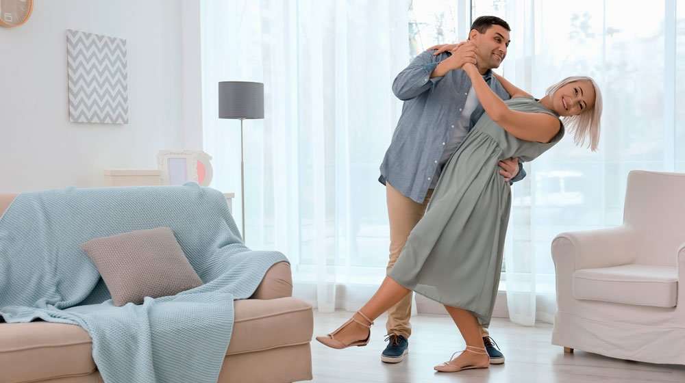mature-happy-couple-dancing-valse-in-living-room-at-home | Feature | Bioidentical Hormone Therapy (BHRT) and Weight Loss