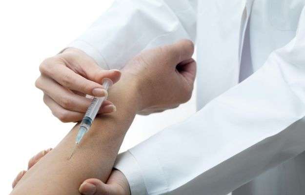 Doctor injecting medicine into the patient_s arm - Examples of Common Treatments | Examples of Common Treatments |