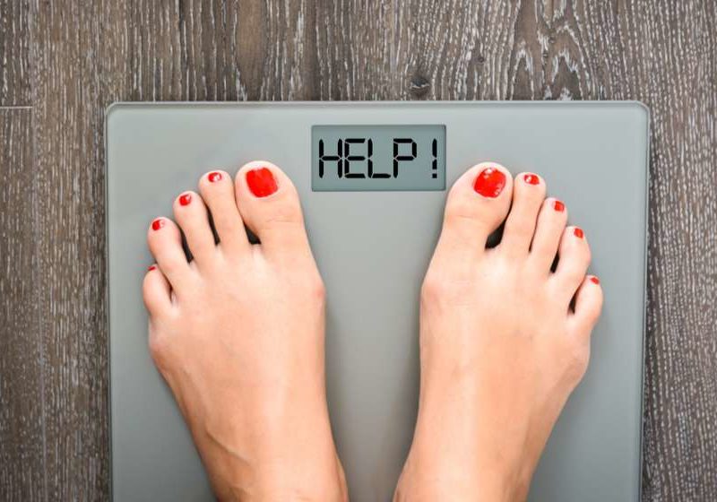 woman feet on a weight scale Finally Lose The Stubborn Weight with Hormone Optimization and Peptide Therapy feat ss