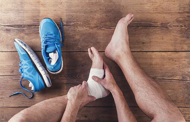  injured-runner-sitting-on-a-wooden-floor-Who-Can-Benefit-From-BPC-157