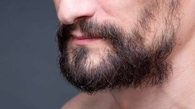 close-up-medium-beard-dark-haired-man | What is Alopecia Barbae? | What is Alopecia Barbae and Why It Happens