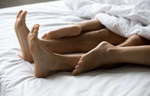 man and woman_s legs under blanket - ss