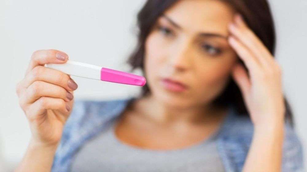 a-women-is-feeling-worried-about-her-pregnancy-test | Feature | Low Progesterone: symptoms, Causes, And What To Do About It
