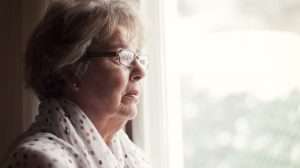 Elderly-Alzheimer-woman-looking-absent | Feature | HRT Could Help Dementia and Alzheimer's in Women, Studies Show