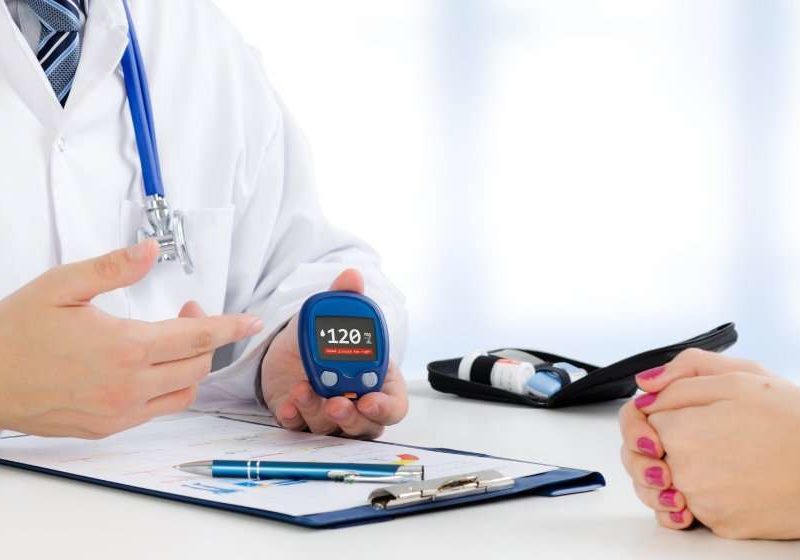 Doctor-shows-glucometer-with-glucose-level | feature | Is Diabetes an Autoimmune Disease? And What Are Possible Treatment Options?