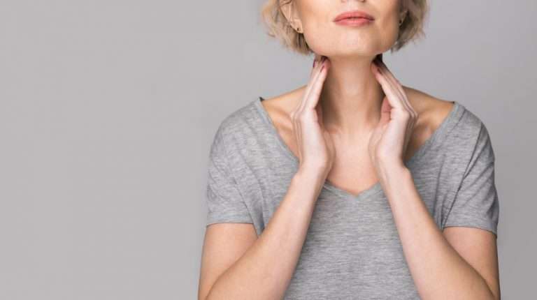 Female-checking-thyroid-gland-by-herself | 4 Special Diets To Help Manage Hypothyroidism | feature