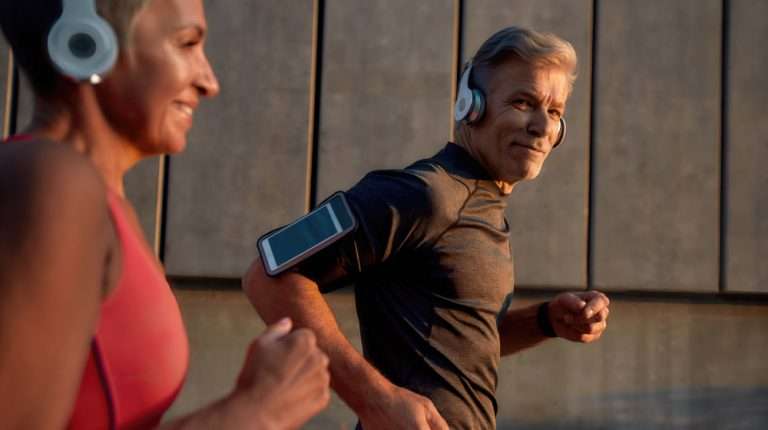 man-in-headphones-running-with-his-wife-through-th…ncrease-Focus,-Energy,-and-Performance | feature | How To Increase Focus, Energy, and Performance