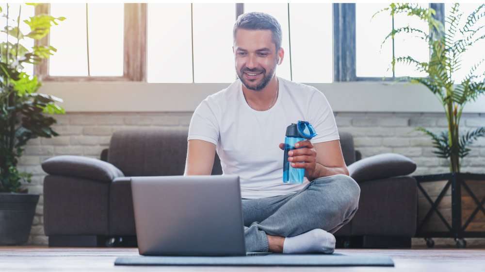 adult-man-using-laptop-and-drinking-water-while-ha…escription-Weight-Loss-Medication-Work | feature | What Is Prescription Weight Loss Medication Work & How Does It Work?