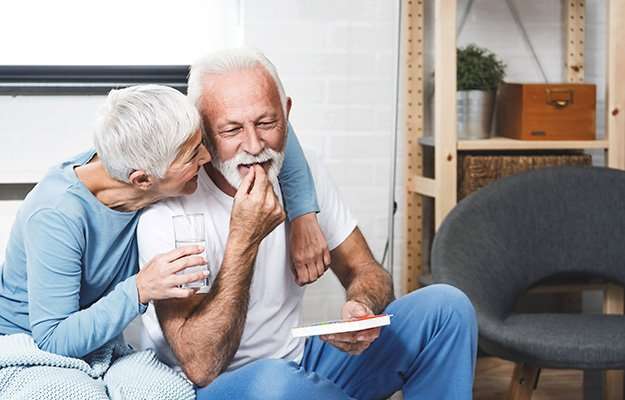 A happy old couple having a medicine | What Are the Benefits of BHRT, and Is It Right for You?