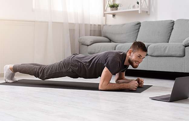 Young-man-doing-plank-exercise-ss-body | What Is A Weight Loss Plateau And How To Break It