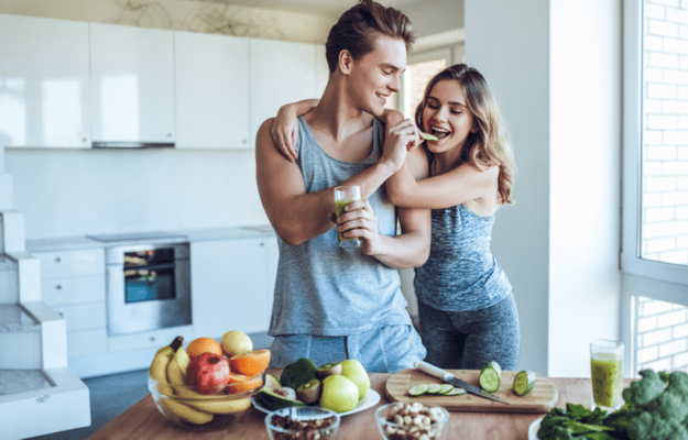 happy couple feeding each other food Boosting Metabolism