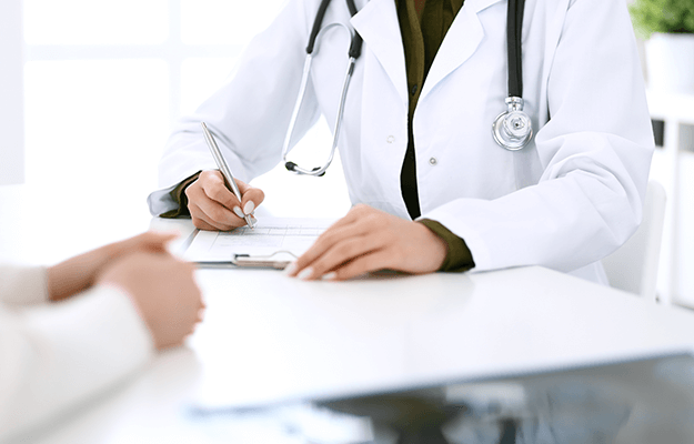 Woman doctor and patient sitting and talking at medical examination at hospital office When Is Medication Used | A Comprehensive Guide to Binge Eating Disorder Medication body ss