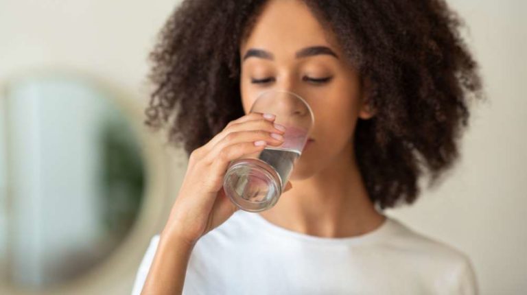 black girl drinking water What Happens to Someone Who Has Fluid Overload