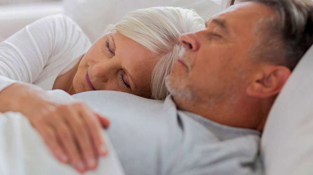 Senior-man-and-woman-resting-with-eyes-closed---Understanding-Male-&-Female-REM-Sleep-Erection
