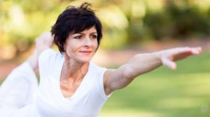 healthy-middle-aged-woman-doing-fitness-stretching-outdoors-Starting-Stopping-Hormone-Replacement-Therapy-Risks-Side-Effects
