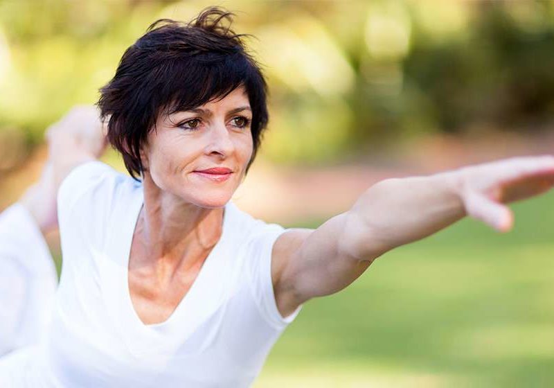 healthy-middle-aged-woman-doing-fitness-stretching-outdoors-Starting-Stopping-Hormone-Replacement-Therapy-Risks-Side-Effects