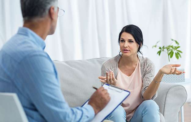 woman-talking-to-doctor-at-home-What-a-Woman-Should-Know-Before-Testosterone-Therapy