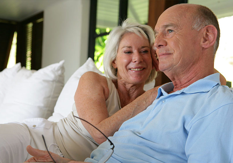 Couple-sat-on-their-veranda-with-laptop-Understanding-Male-Menopause-How-It-Can-Affect-Your-Health