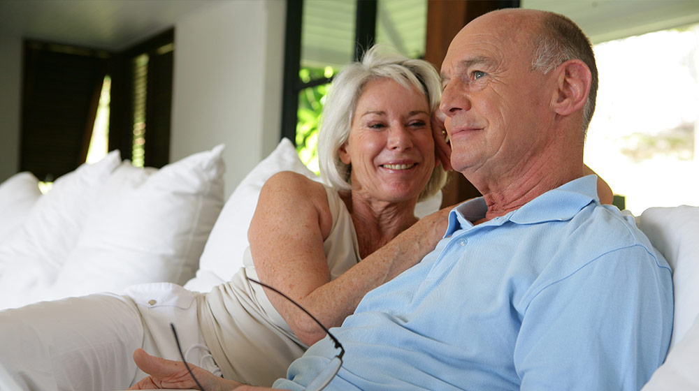 Couple-sat-on-their-veranda-with-laptop-Understanding-Male-Menopause-How-It-Can-Affect-Your-Health