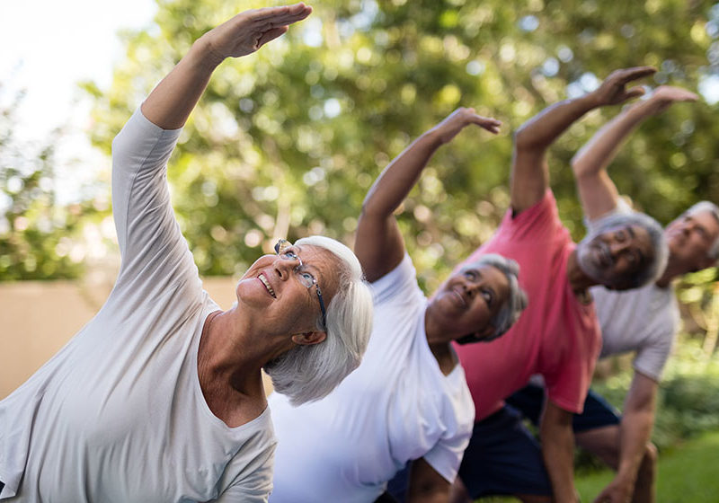 Senior-people-looking-up-while-exercising-with-arms-raised-How-Long-Does-It-Take-for-Testosterone-Replacement-Therapy-to-Work