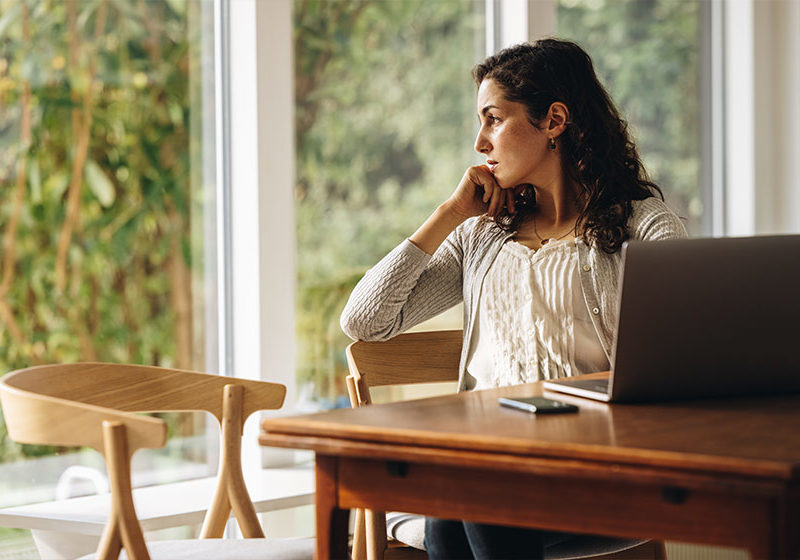 Woman-taking-a-break-from-work-at-home-Early-Menopause-Linked-to-Increased-Risk-of-Presenile-Dementia