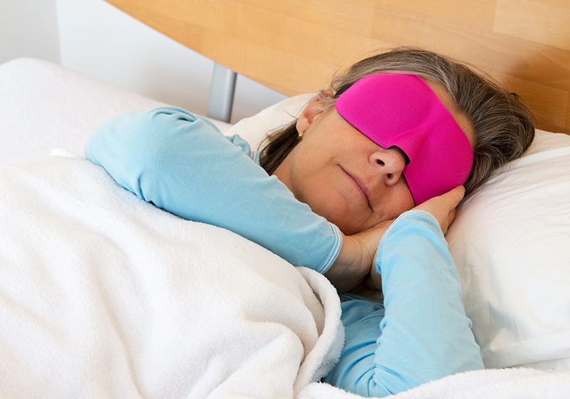 woman-sleeping-with-sleep-mask-How-Does-Menopause-Affect-Sleep