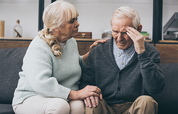retired-woman-sitting-near-senior-husband-with-headache-Prevent-Dementia-and-Neurodegeneration