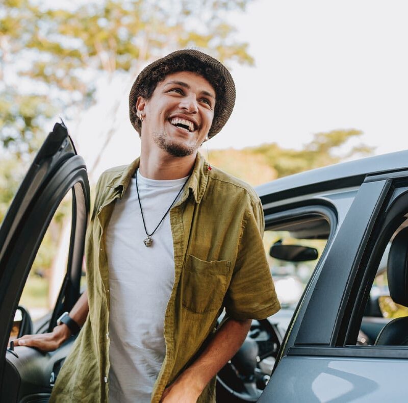 younger man smiling after starting testosterone therapy
