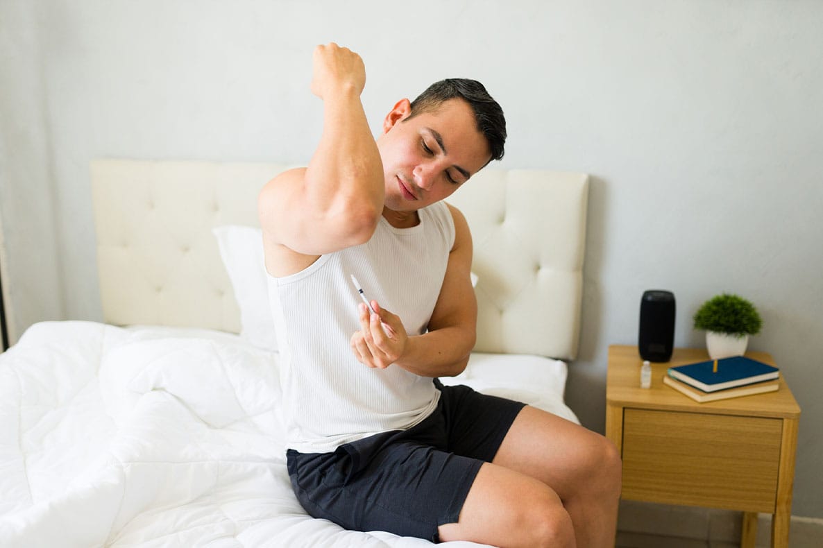 man giving himself a testosterone injection