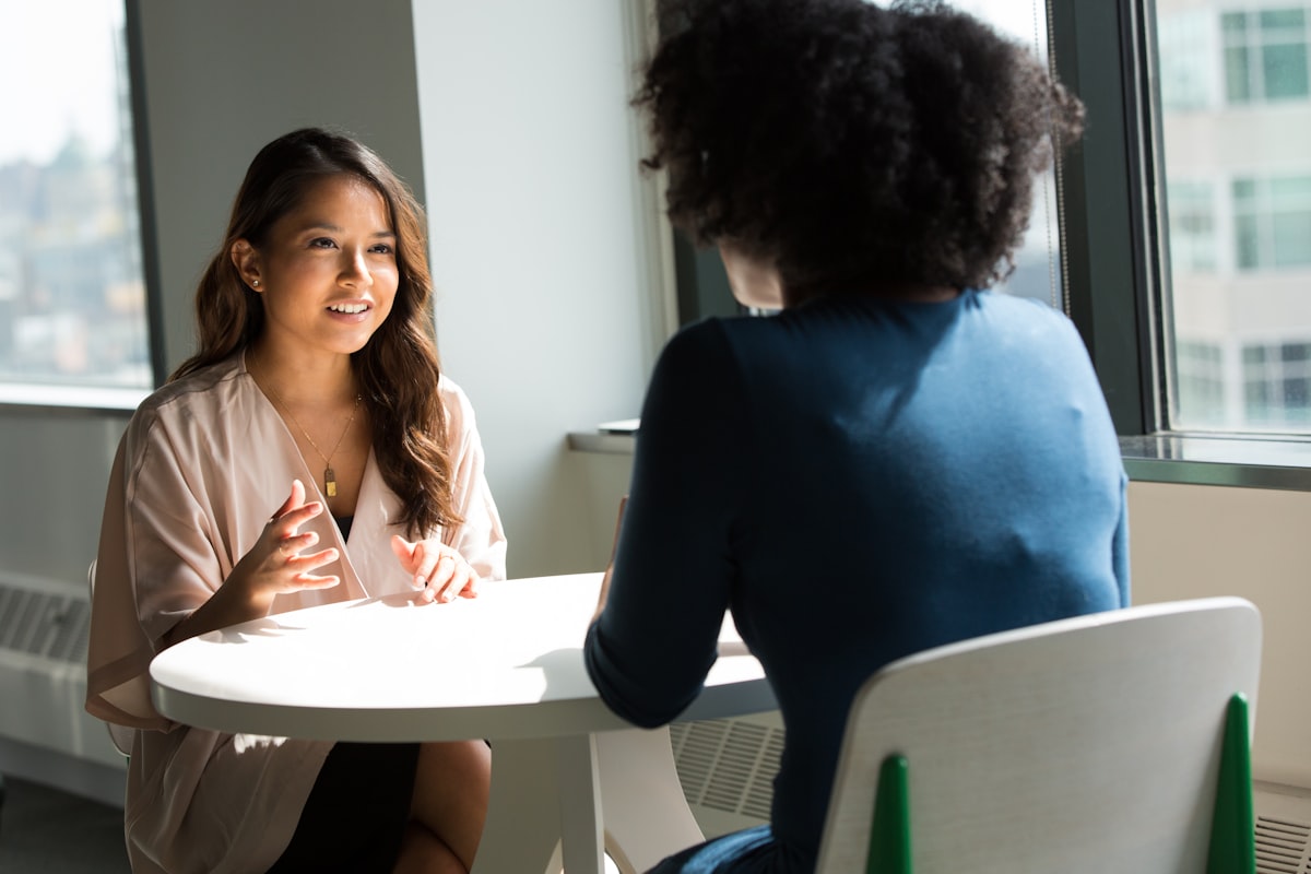 Two women in a relaxed health consultation - Yunique Medical