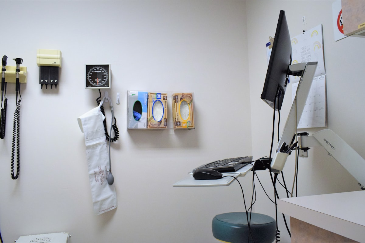 Calm modern medical exam room ready for a patient consultation - Yunique Medical