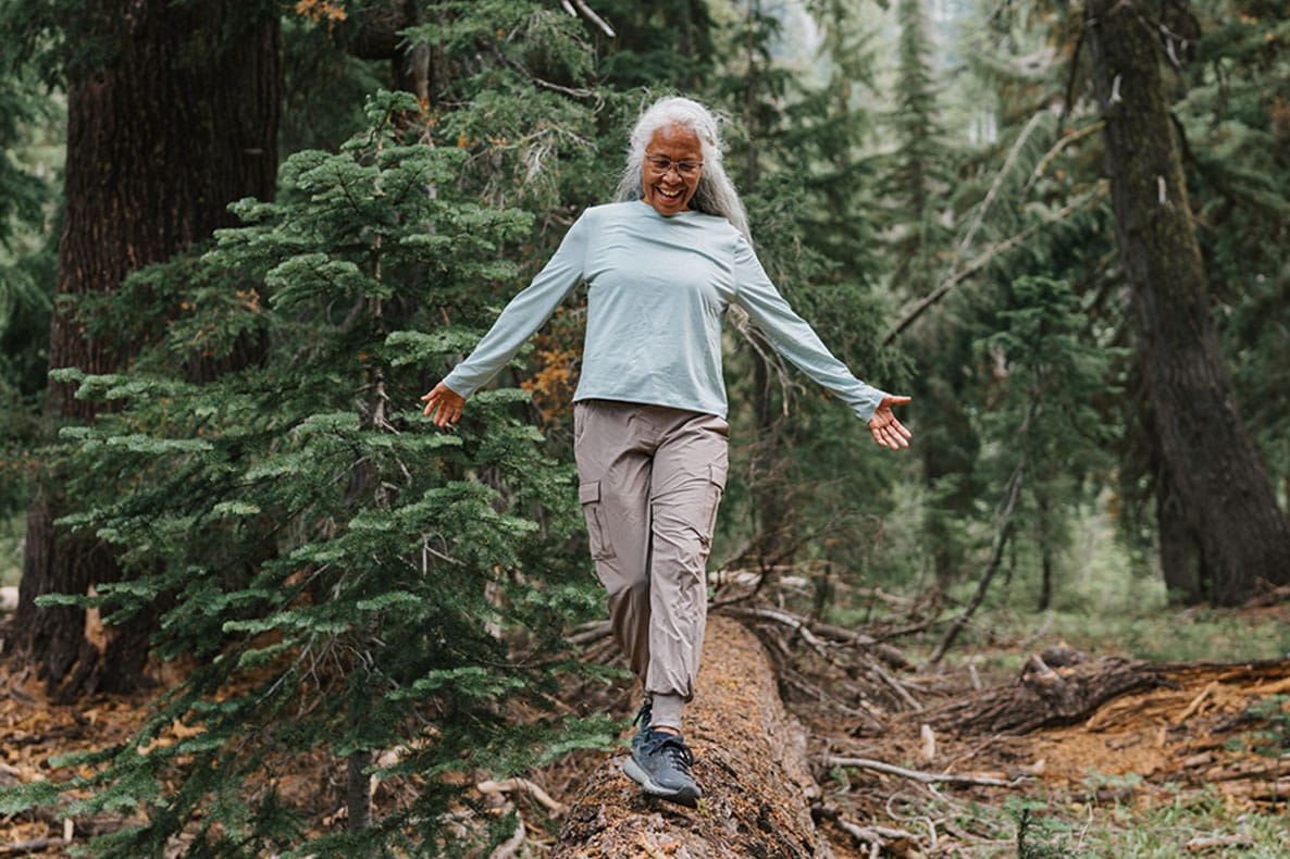 older woman hiking after getting therapeutic plasma exchange