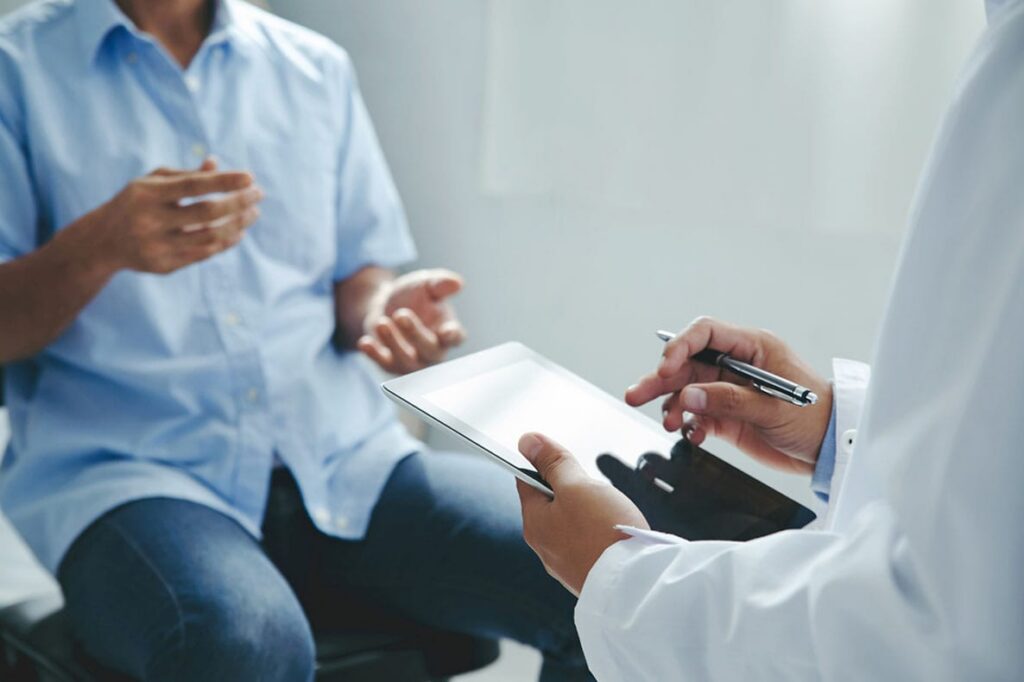 man having a consultation for peptide therapy with his doctor in Florida