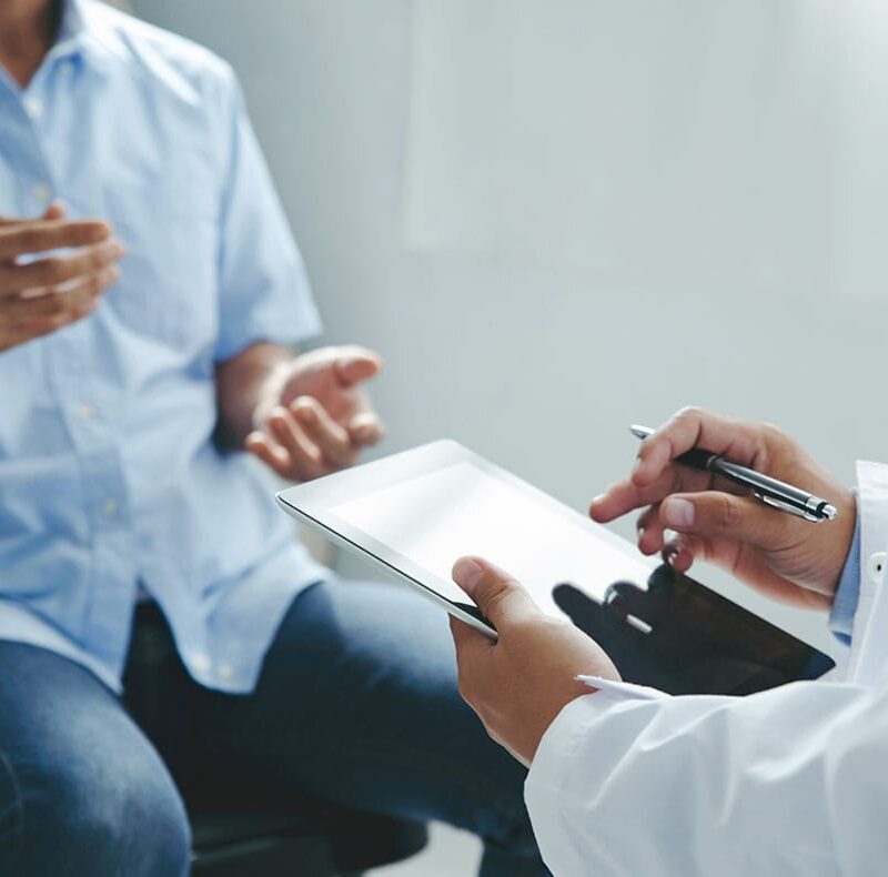 man having a consultation for peptide therapy with his doctor in Florida