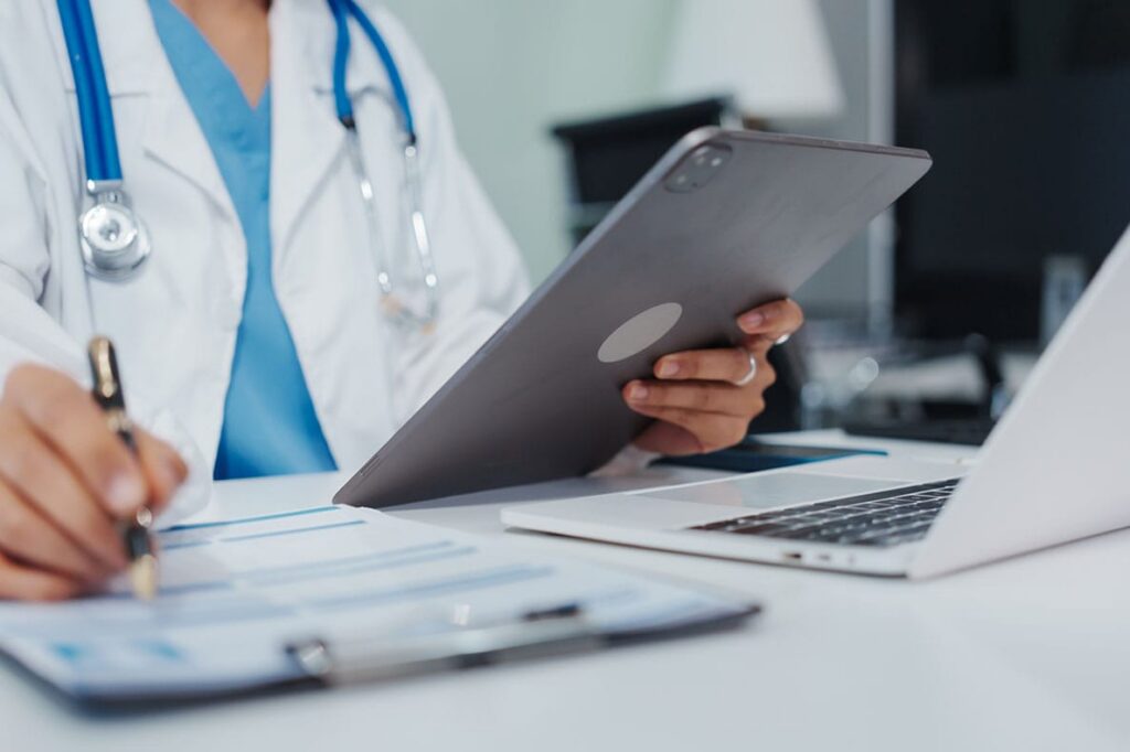 doctor reviewing teleheath information in Florida