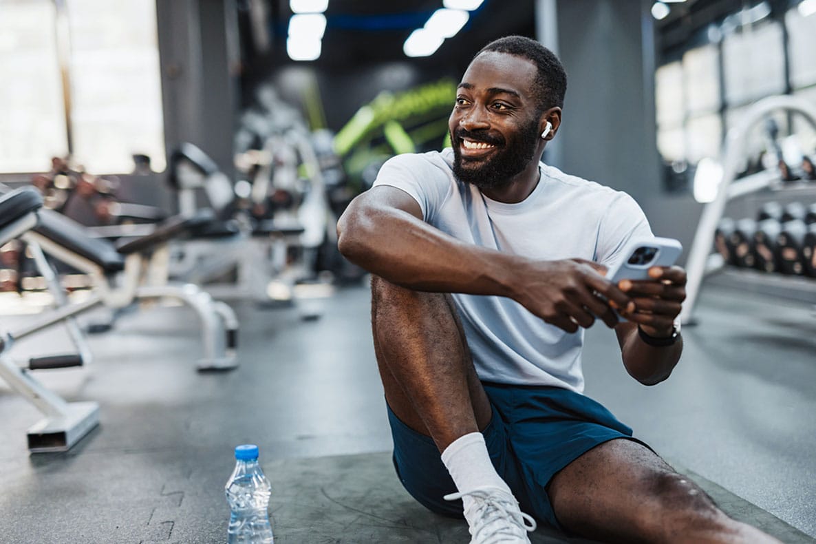 man smiling at the gym after starting testosterone therapy in Florida